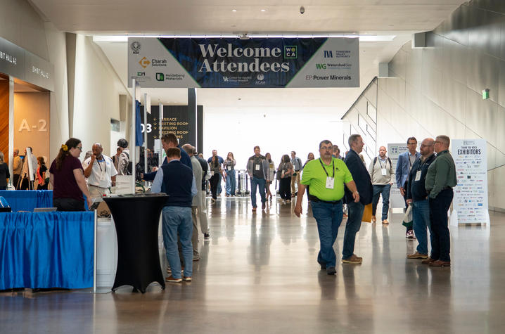 Attendees to WOCA gather at the registration desk