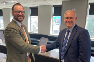 Schaub with Rodney Andrews, director of CAER and chair of KNEDA.